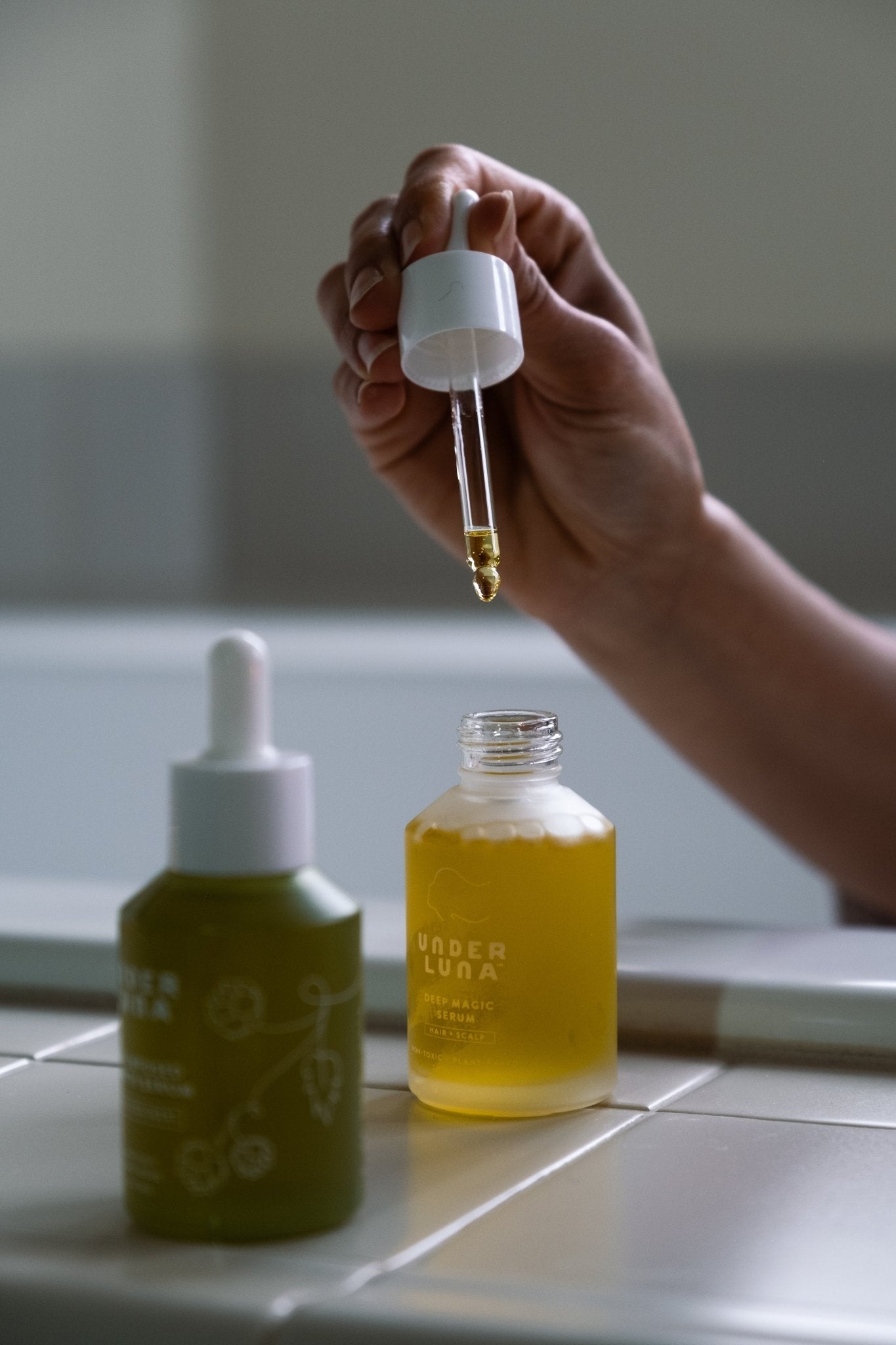 Scalp Care Booster Set - UNDER LUNA™ woman showing dropper